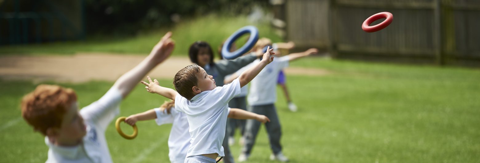 children throwing hoops