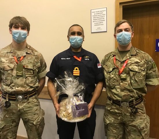 the Navy and Army team meet with a present from Banstead Prep