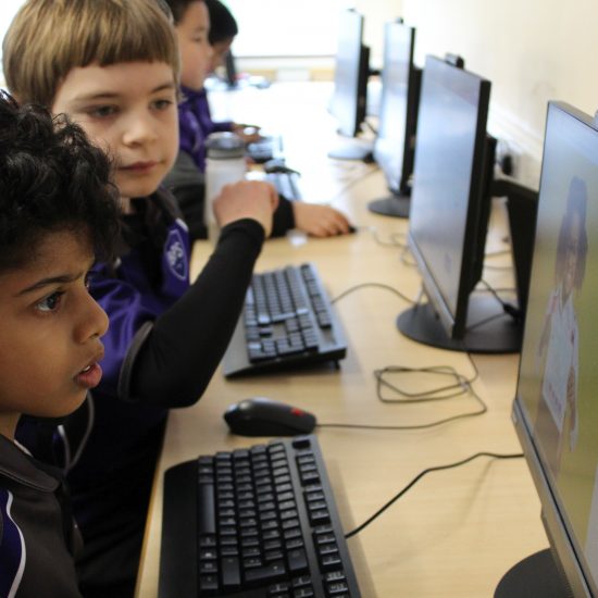 Children looking at a PC screen