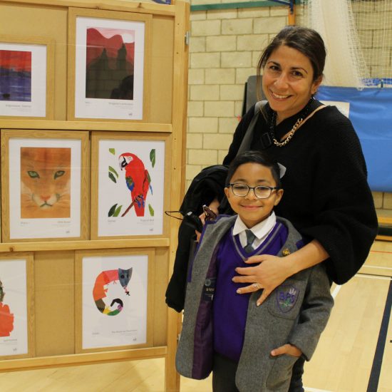 a child and their mother at an art exhibition