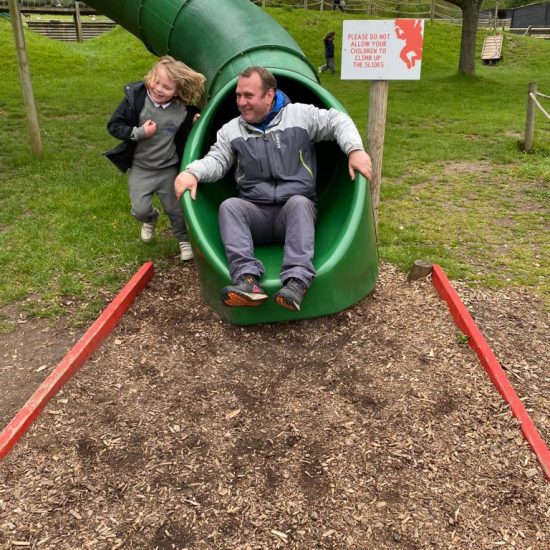 a man coming out of a slide