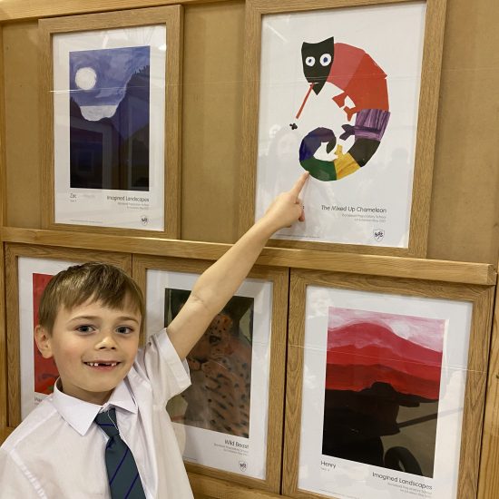 a child pointing at a picture