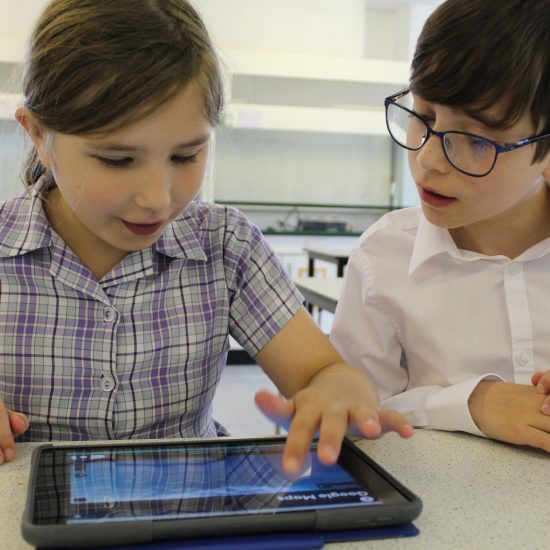 Children from a prep school in Surrey using a tablet