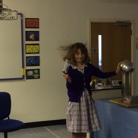 a girl experimenting with static electricity