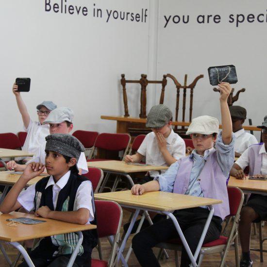 children sat in a victorian lesson