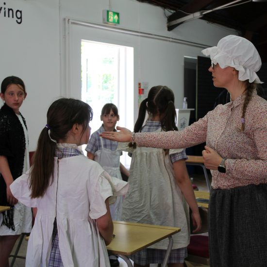 year 5 children having a victorian classroom experience