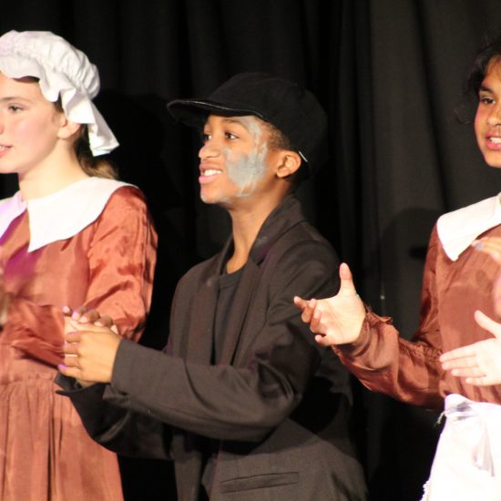 Children as a part of the Oliver! Jr production