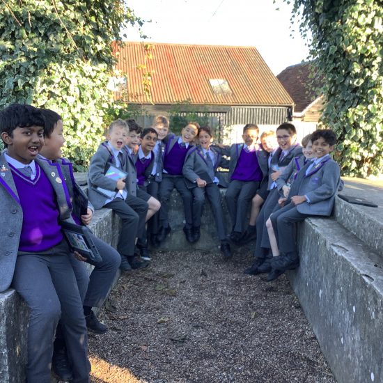 Students sat around a concrete ledge