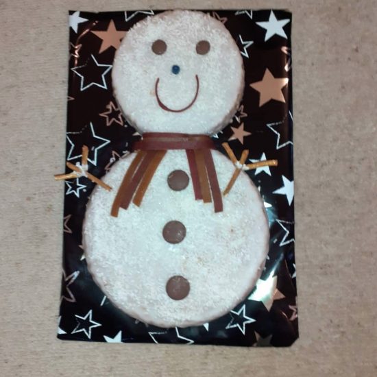 A snow man cake baked by a boy from a prep school in Surrey