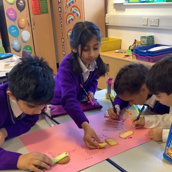 Students using biscuits for a lesson