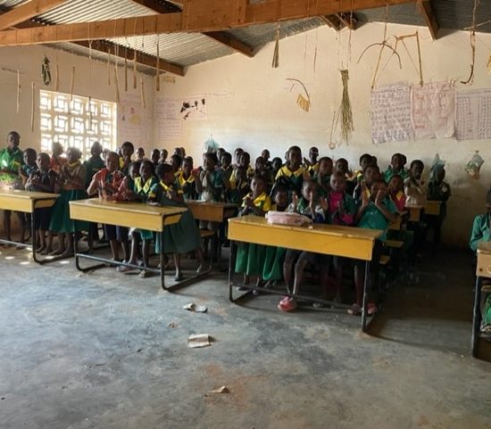 Groups of school children in the classroom