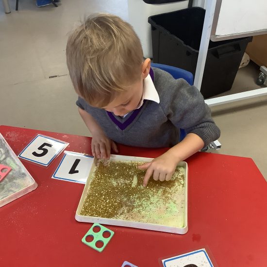 student working with glitter
