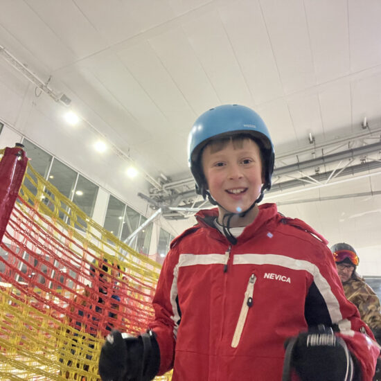 smiling student in skiing wear