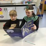 2 students reading a book